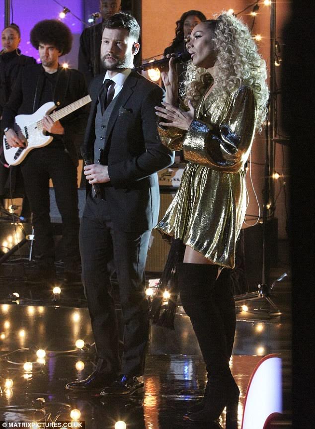 Leona Lewis wears the Gold Lame Wrap Top as a dress